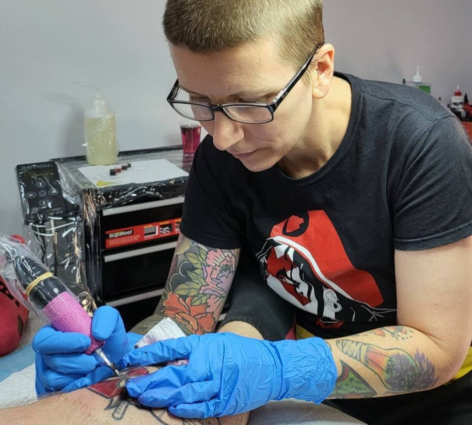 Wild Honey Tattoo Studio - Dan working on client leg
