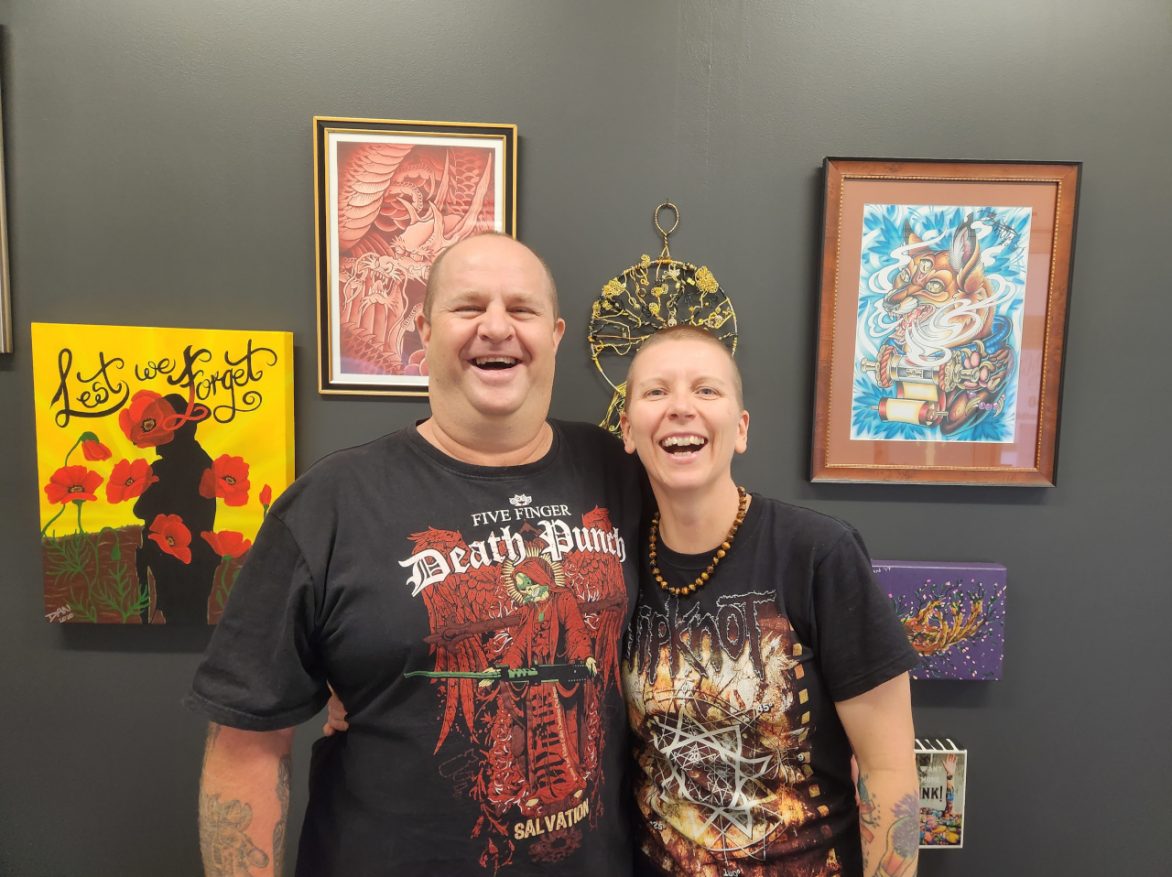 Wild Honey Tattoo Studio - Dan & Ken in front of studio paintings