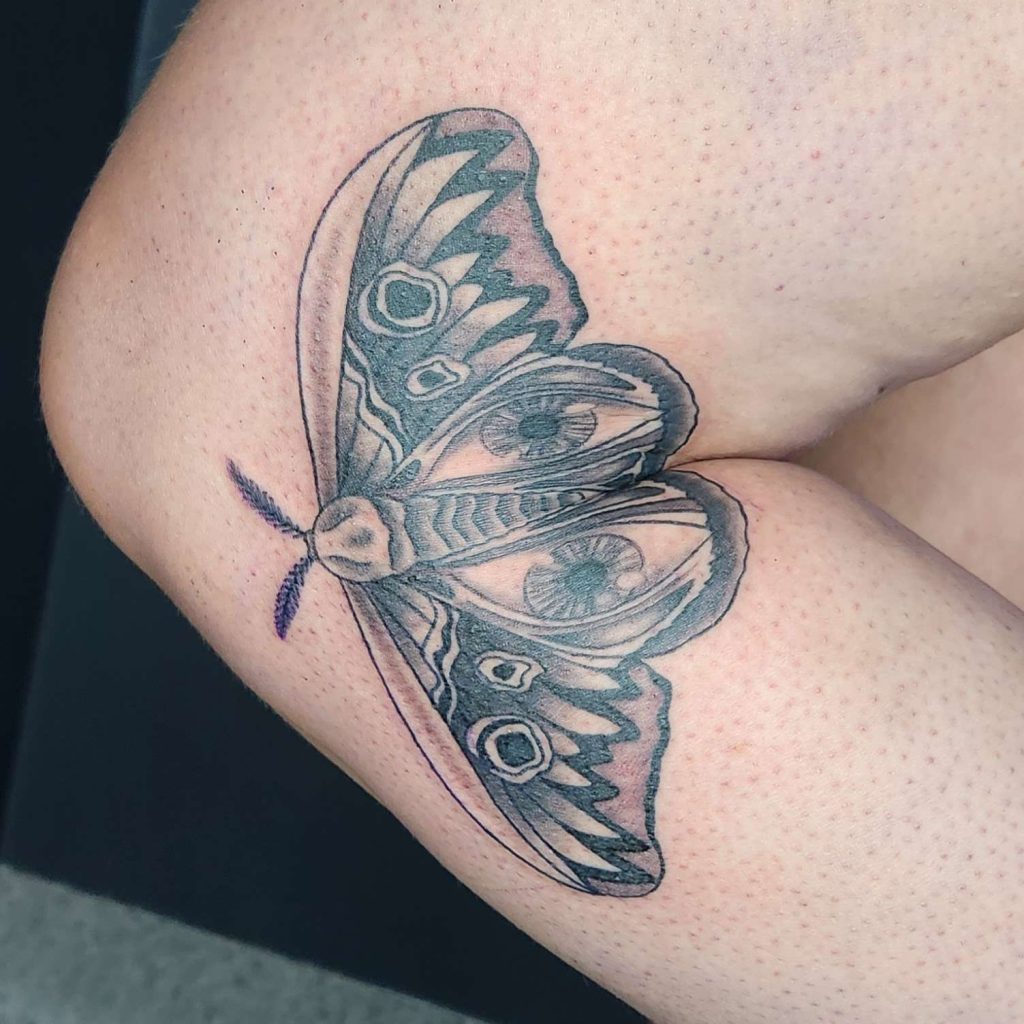 Black and White Moth Elbow tattoo